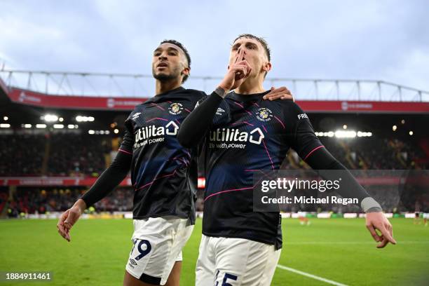 Alfie Doughty of Luton Town celebrates with Jacob Brown of Luton Town after scoring their team's first goal during the Premier League match between...