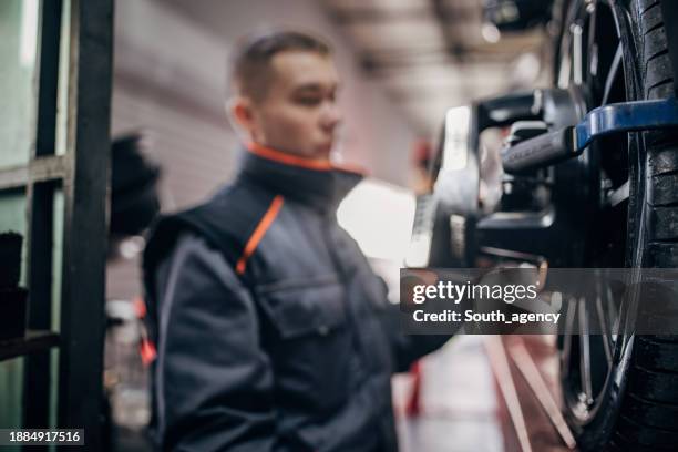 Mechanic Alignment 151 Wheel Alignment And Balancing Stock Photos, High-Res Pictures, and ...