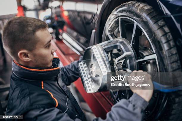 Mechanic Alignment 151 Wheel Alignment And Balancing Stock Photos, High-Res Pictures, and ...