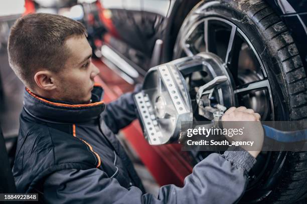 Mechanic Alignment 155 Wheel Alignment And Balancing Stock Photos, High-Res Pictures, and ...