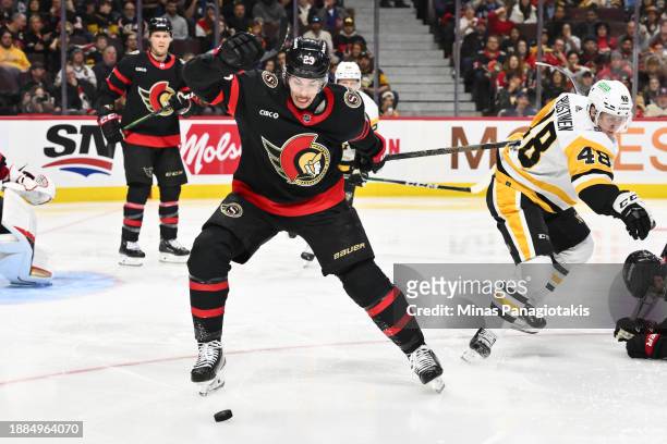Travis Hamonic of the Ottawa Senators skates after the puck during the third period against the Pittsburgh Penguins at Canadian Tire Centre on...