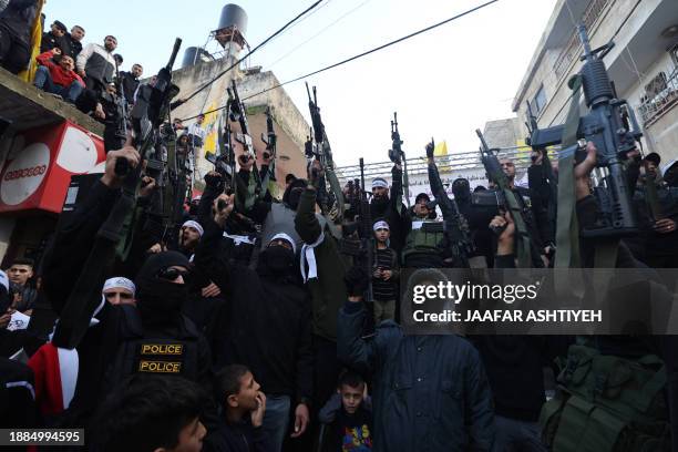 Palestinian gunmen from the Balata brigade of the Al-Aqsa Martyrs Brigades armed group, rally in the Balata refugee camp in the occupied West Bank,...