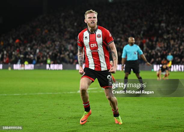 Oliver McBurnie of Sheffield United celebrates after scoring their team's first goal during the Premier League match between Sheffield United and...