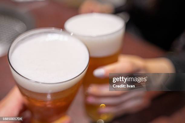 woman and man toasting with bottle beer together - sky bar stock pictures, royalty-free photos & images