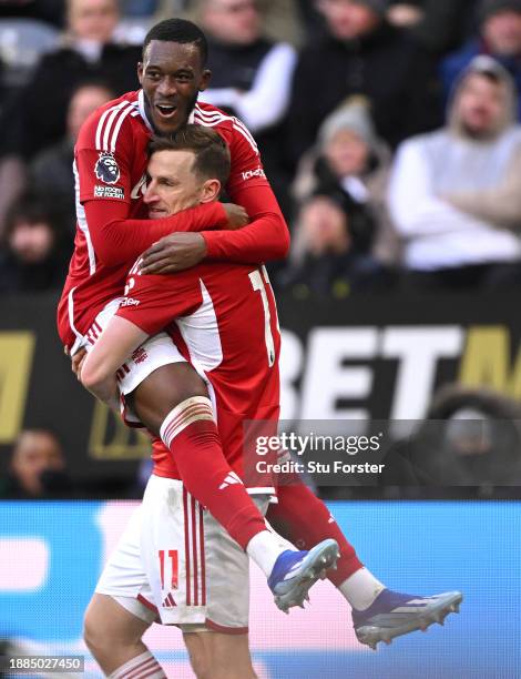 Chris Wood of Nottingham Forest celebrates his hat trick goal with team mate Callum Hudson-Odoi after scoring their sides third goal during the...