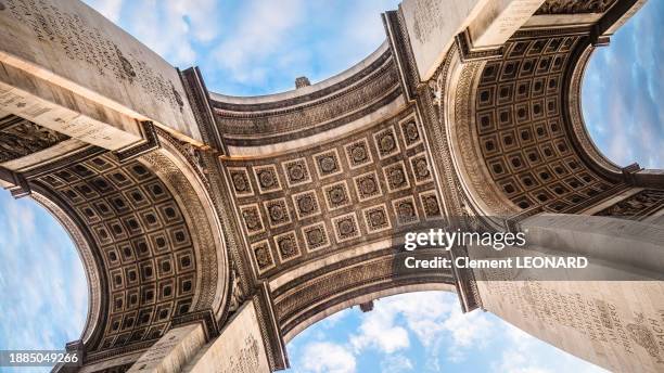 wide angle view of the ceiling and pillars of the arc de triomphe of paris (paris triumphal arch) as seen from below, paris, ile-de-france (ile de france), central france. - champs élysées stock pictures, royalty-free photos & images