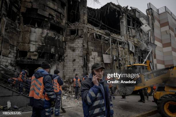 Officials work around the destruction after Russian airstrikes which killed 6 and injured around 28 people including a baby and severely damaged...