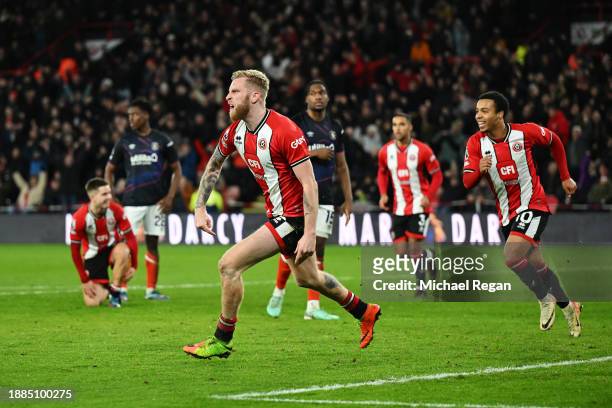 Oliver McBurnie of Sheffield United celebrates after scoring their team's first goal during the Premier League match between Sheffield United and...