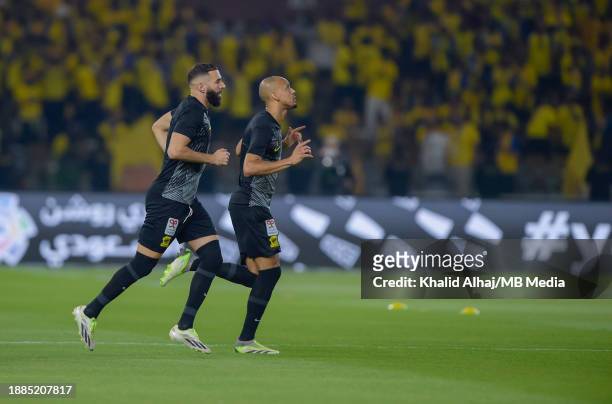 Fabinho of Al-Ittihad and Karim Benzema of Al-Ittihad warming up before the Saudi Pro League match between Al-Ittihad and Al-Nassr at Prince Abdullah...