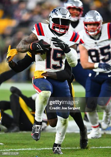 Ezekiel Elliott of the New England Patriots in action during the game against the Pittsburgh Steelers at Acrisure Stadium on December 7, 2023 in...