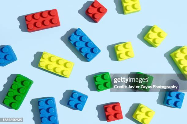 colorful toy blocks on blue - giocattoli foto e immagini stock