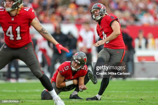 Chase McLaughlin of the Tampa Bay Buccaneers watches a field goal off of the hold of Jake Camarda during the first half of the game against the...