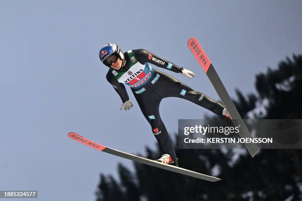 Germany's Andreas Wellinger soars through the air during the trial round before the competition, the first stage of the Four-Hills tournament that is...