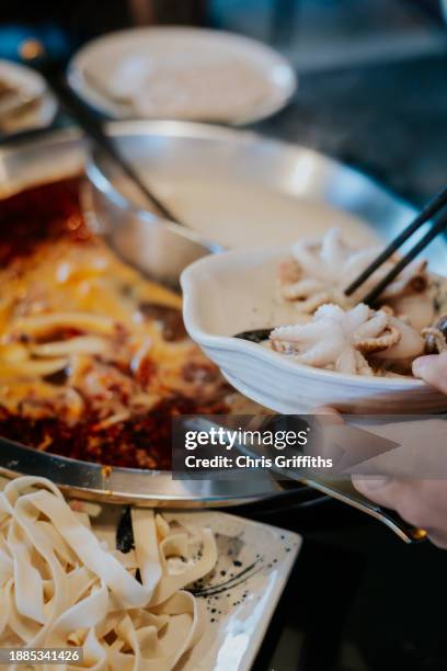 korean style shabu shabu hotpot, bristol, england, united kingdom - soup bowl stock pictures, royalty-free photos & images