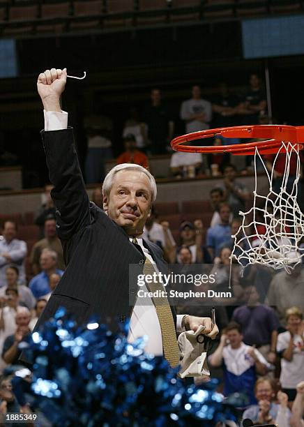 Head coach Roy Williams of Kansas cuts the net after defeating Arizona 78-75 in the NCAA Tournament at Arrowhead Pond on March 29, 2003 in Anaheim,...