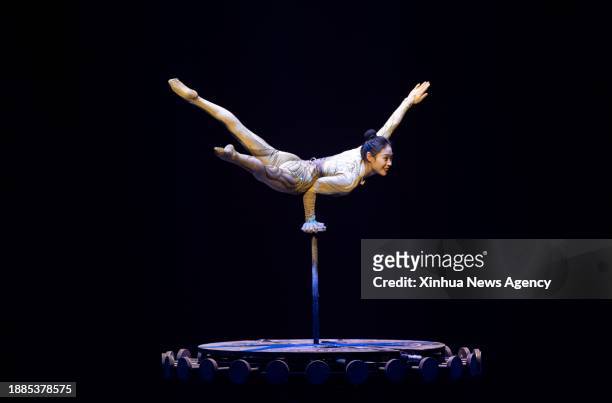 Acrobat Wang Mengchen of China's Jiangsu Acrobatic Troupe performs in Stuttgart, Germany, Dec. 28, 2023. An acrobatic performance by China's Jiangsu...