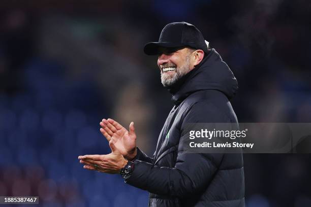 Juergen Klopp, Manager of Liverpool, applauds the fans at full-time following their team's victory in the Premier League match between Burnley FC and...
