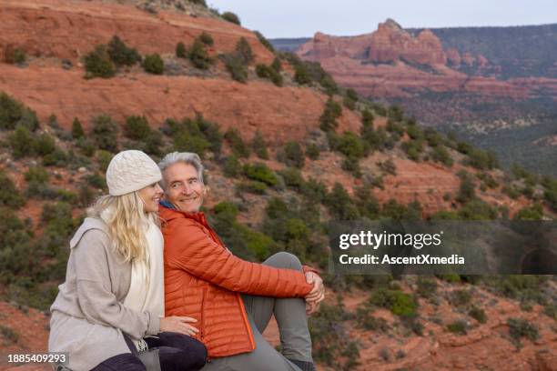 mature couple enjoy desert landscape - senior man grey long hair stock pictures, royalty-free photos & images