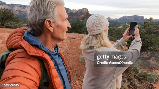 mature couple take photo from viewpoint - senior man grey long hair stock pictures, royalty-free photos & images