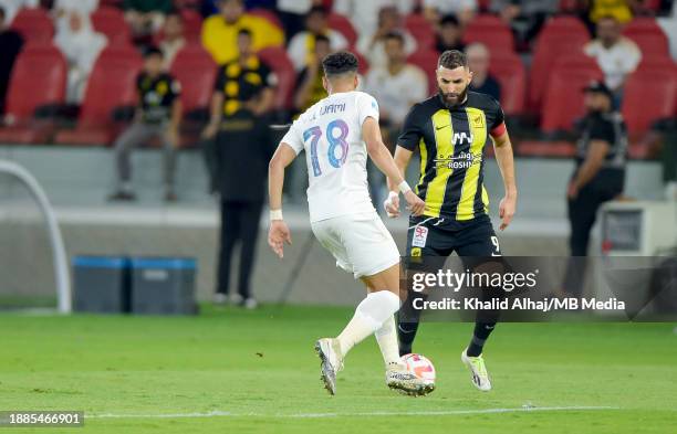 Karim Benzema of Al-Ittihad under pressure during the Saudi Pro League match between Al-Ittihad and Al-Nassr at Prince Abdullah Al Faisal Stadium on...