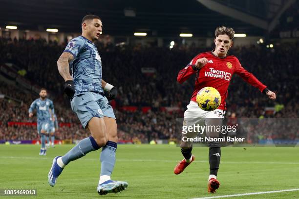 Diego Carlos of Aston Villa competes for the ball with Alejandro Garnacho of Manchester United during the Premier League match between Manchester...