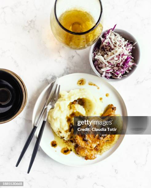 mashed potatoes with chicken piccata on white background - mashed potatoes stock-fotos und bilder