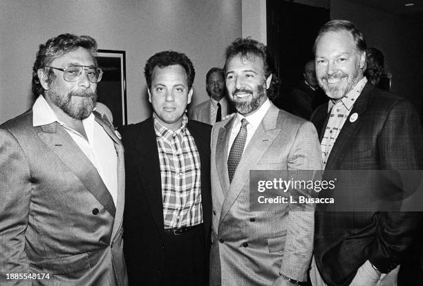 American singer songwriter Billy Joel poses with music executives Walter Yetnikoff and Tommy Mattola along with Joels manager Frank Weber at The Hard...