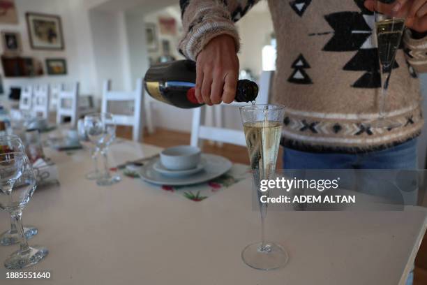 Glass of sparkling wine is poured at the Vinkara winery, in Kalecik in the district of Ankara Province, on December 18, 2023. Turkish sparkling wines...