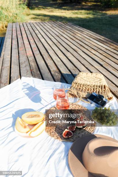 picnic at the pier near the water. romantic picnic. stylish lifestyle. beautiful table setting for a holiday in nature. - champange bottle and valentines day stock pictures, royalty-free photos & images