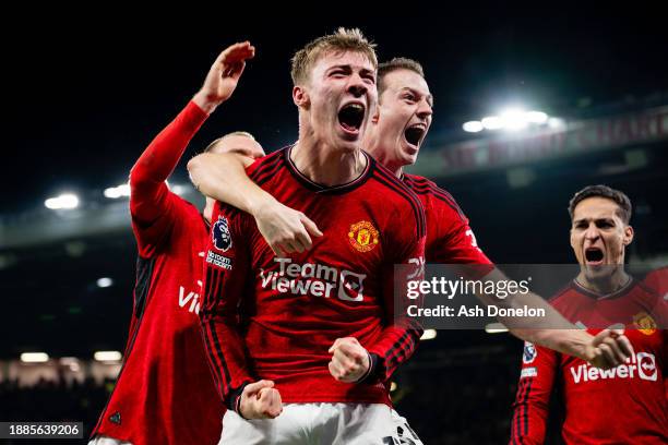 Rasmus Hojlund of Manchester United celebrates with team mates after scoring their sides third goal during the Premier League match between...
