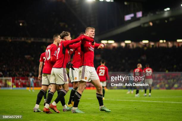 Rasmus Hojlund of Manchester United celebrates with team mates after scoring their sides third goal during the Premier League match between...