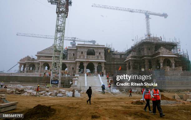 Workers are seen at construction site for the temple of Hindu Lord Ram on December 29, 2023 in Ayodhya, India. The Ram Mandir, built at a site...