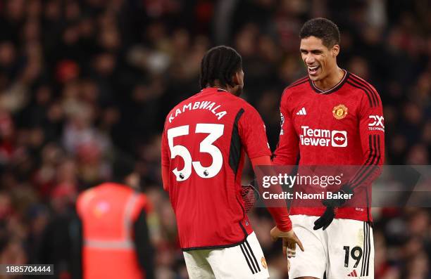Raphael Varane of Manchester United celebrates after winning the match with Willy Kambwala of Manchester United of Manchester United during the...