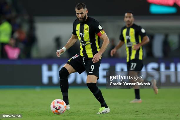 Karim Benzema of Al-Ittihad runs with the ball uring the Saudi Pro League match between Al-Ittihad and Al-Nassr at Prince Abdullah Al Faisal Stadium...