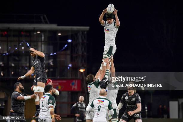 Pau's French hooker Hugo Auradou catches the ball as he is lifted in the air from a Pau line out during the French Top14 rugby union match between...