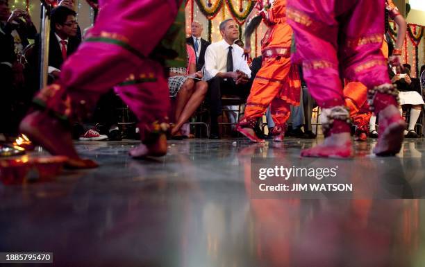 President Barack Obama and First Lady Michelle Obama watch a cultural event at The Holy Name High School in Mumbai on November 7, 2010. Barack...