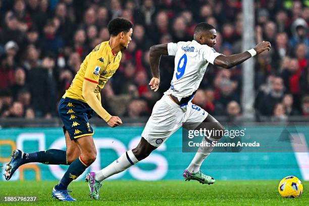 Koni De Winter of Genoa and Marcus Thuram of Inter vie for the ball during the Serie A TIM match between Genoa CFC and FC Internazionale at Stadio...