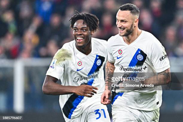 Marko Arnautovic of Inter celebrates with his team-mate Yann Bisseck after scoring a goal during the Serie A TIM match between Genoa CFC and FC...