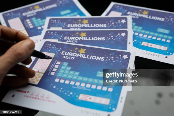 Man is checking a box to pick numbers on a betting card for the EuroMillions jackpot in this photo illustration taken in Brussels, Belgium, on...