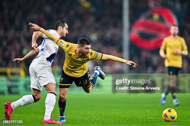 Henrikh Mkhitaryan of Inter and Stefano Sabelli of Genoa vie for the ball during the Serie A TIM match between Genoa CFC and FC Internazionale at...