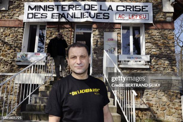 Mohamed Mechmache, president of the ACLEFEU , poses in front of the "Ministry of the Suburbs' Crisis" in Clichy-sous-Bois on March 12, 2012. AFP...