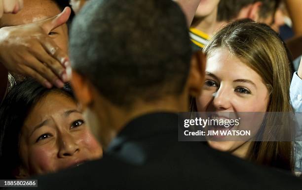 President Barack Obama shakes hands with students at Thomas Jefferson High School for Science and Technology in Alexandria, Virginia, on September...