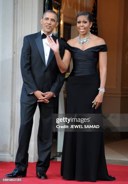 President Barack Obama and First Lady Michelle Obama wait to greet Britain's Queen Elizabeth II and Prince Philip, the Duke of Edinburgh, for a...