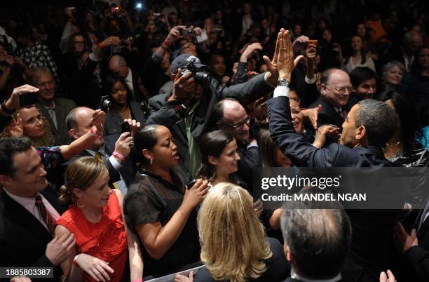 President Barack Obama greets supporters after speaking April 20, 2011 at a DNC fundraiser at Nob Hill Masonic Center in San Francisco. AFP...