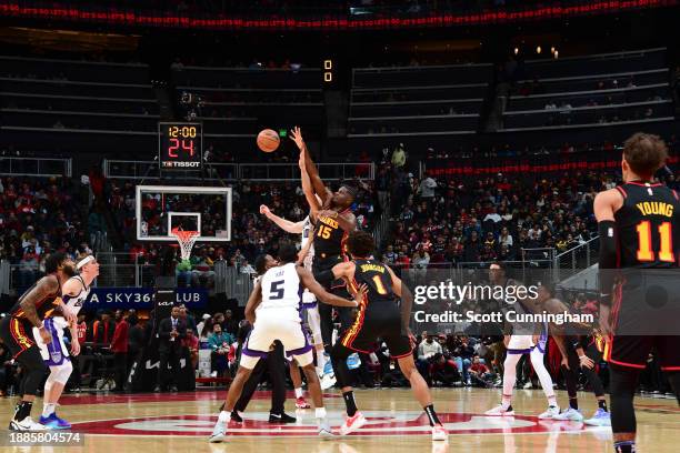 Domantas Sabonis of the Sacramento Kings & Clint Capela of the Atlanta Hawks during open tip-off on December 29, 2023 at State Farm Arena in Atlanta,...