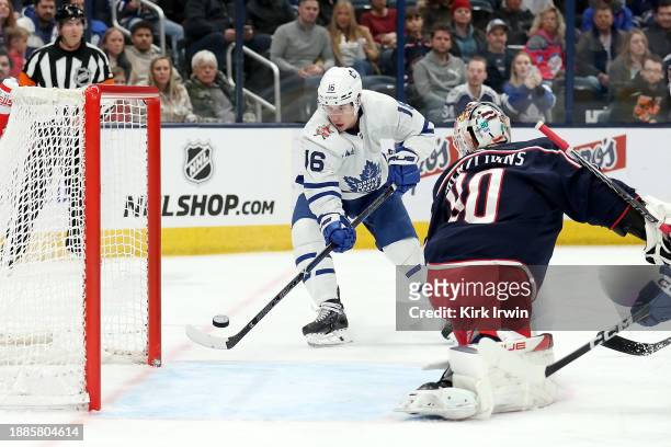 Mitchell Marner of the Toronto Maple Leafs beats Elvis Merzlikins of the Columbus Blue Jackets for a goal during the first period of the game at...