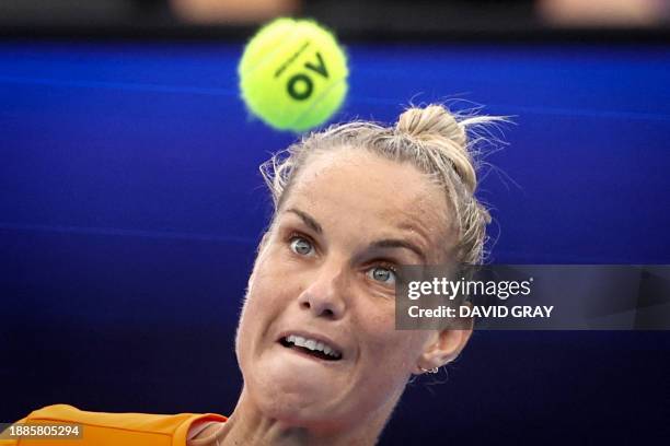 Netherlands' Arantxa Rus hits a return against Norway's Malene Helgo during their women's singles match at the United Cup tennis tournament on Ken...