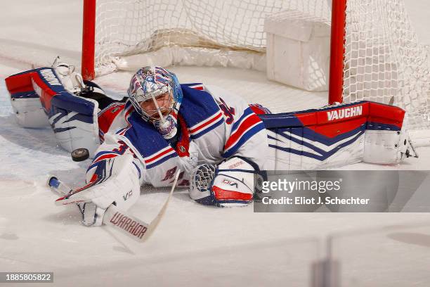 Goaltender Jonathan Quick of the New York Rangers extends himself defending the net against the Florida Panthers at the Amerant Bank Arena on...