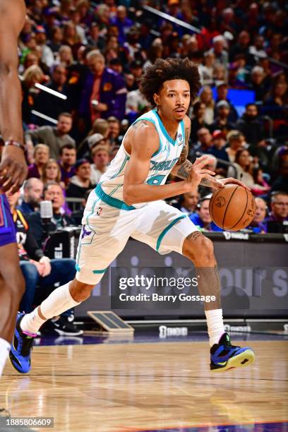 Nick Smith Jr. #8 of the Charlotte Hornets dribbles the ball during the game against the Phoenix Suns on December 29 2023 at Footprint Center in...