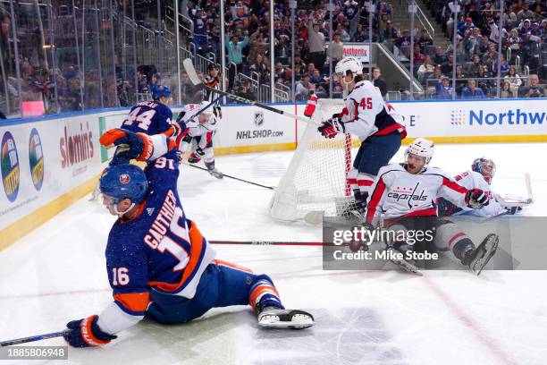 Julien Gauthier of the New York Islanders scores his second goal past Darcy Kuemper of the Washington Capitals during the third period at UBS Arena...